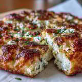 Warm Fluffy Cottage Cheese Flatbread stacked on a wooden board, perfect for wraps or dipping in hummus.