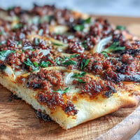 Turkish Lahmacun Pizza with savory lamb topping, crispy crust, and sumac.